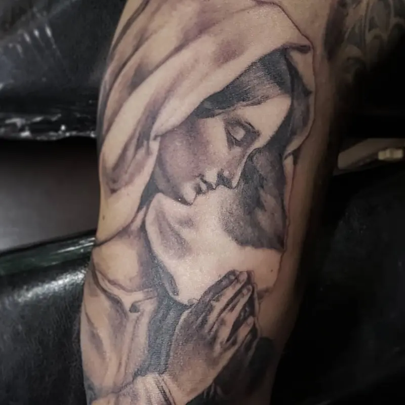 Black and gray realism tattoo of the Virgin Mary in prayer, by Philipus