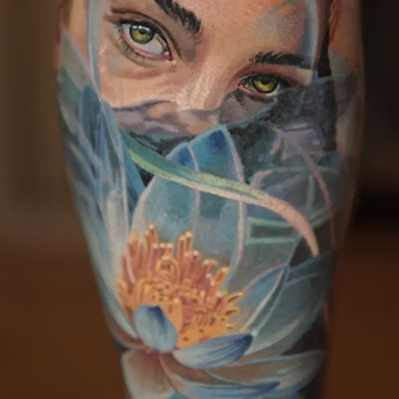 Color realism eyes and lotus flower tattoo by guest artist Soma Kiraly at Killer Silver Tattoo Studio