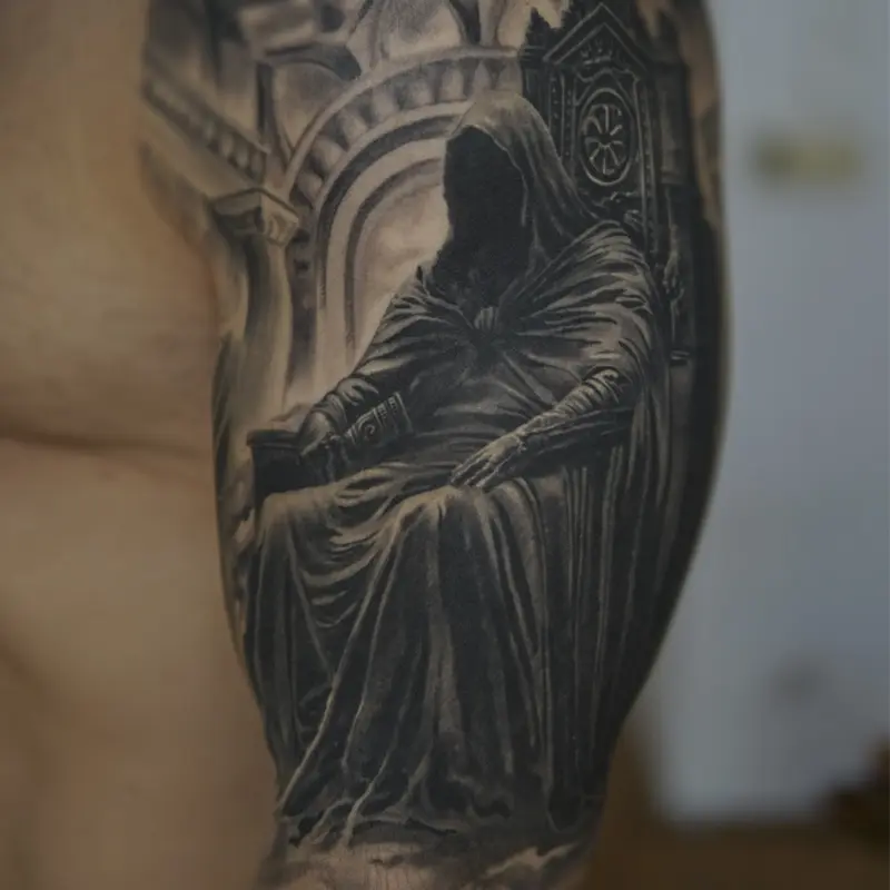 Black and grey hooded figure realism tattoo by guest artist Soma Kiraly at Killer Silver Tattoo Studio