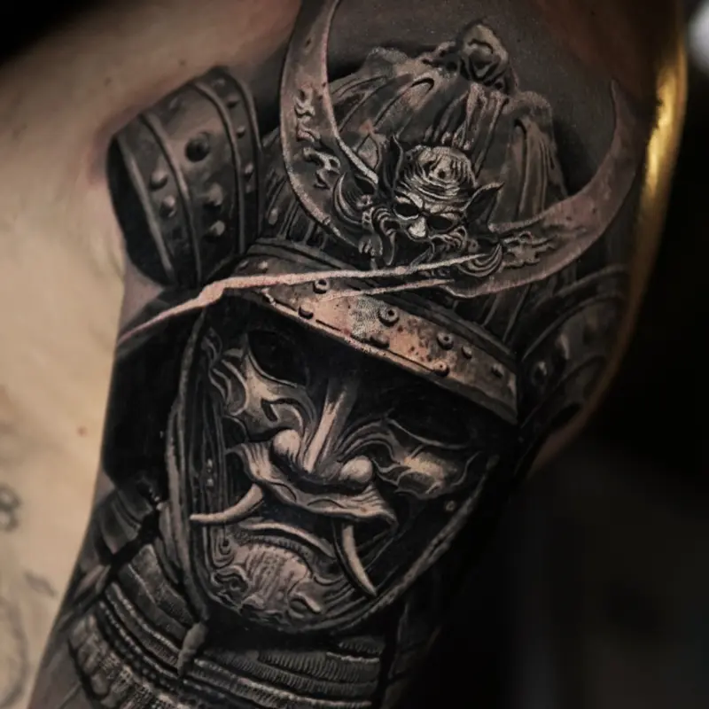 Black and grey samurai helmet realism tattoo by guest artist Soma Kiraly at Killer Silver Tattoo