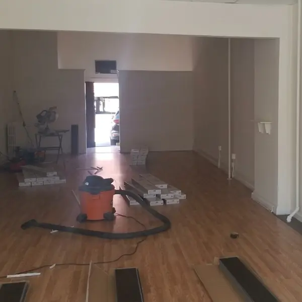 New flooring going down in the former gym at 34 Garth Rd in Scarsdale, NY, as the build-out begins, 2021