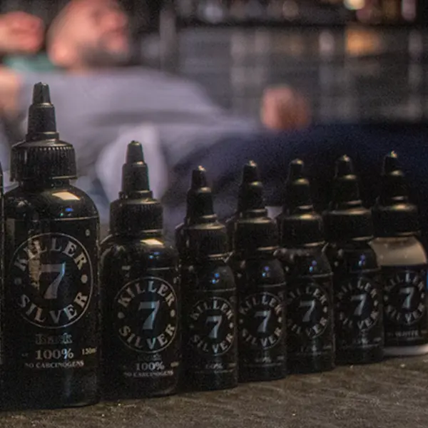 Killer Silver Se7en Deadly Shades gray-wash tattoo ink bottles lined up from 100% black to white