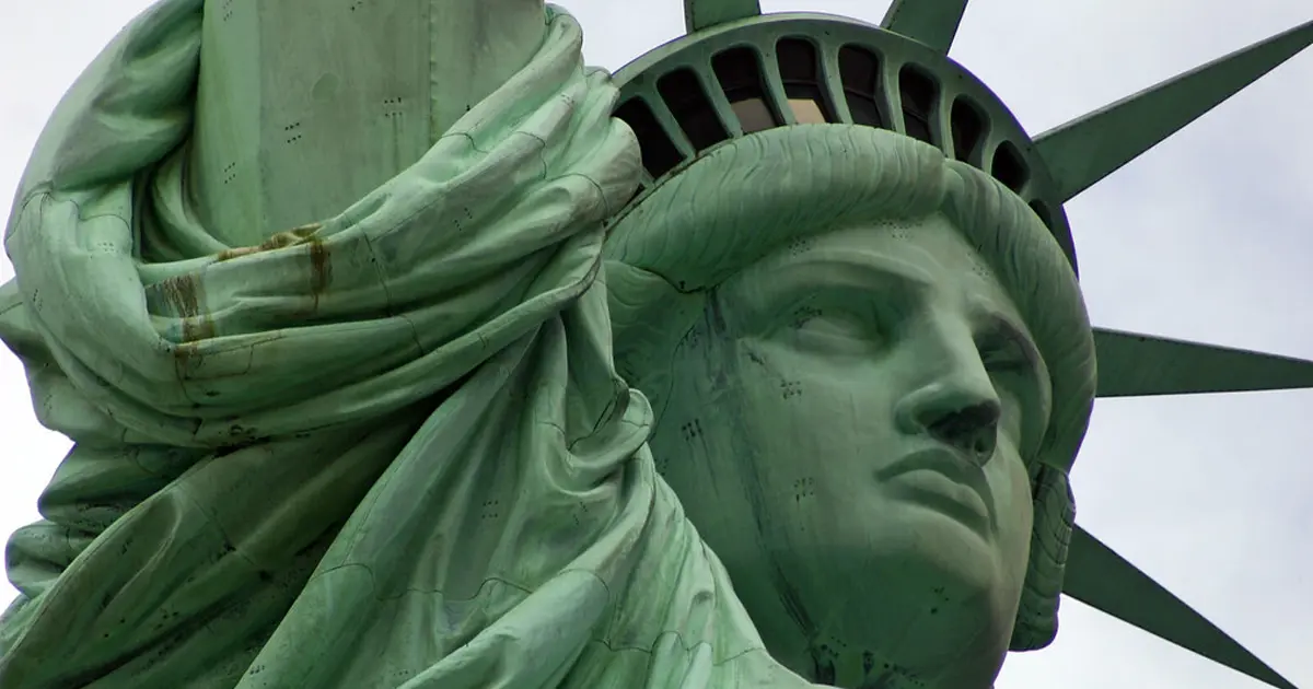 Statue of Liberty face and crown in green copper, a symbol of freedom and independence